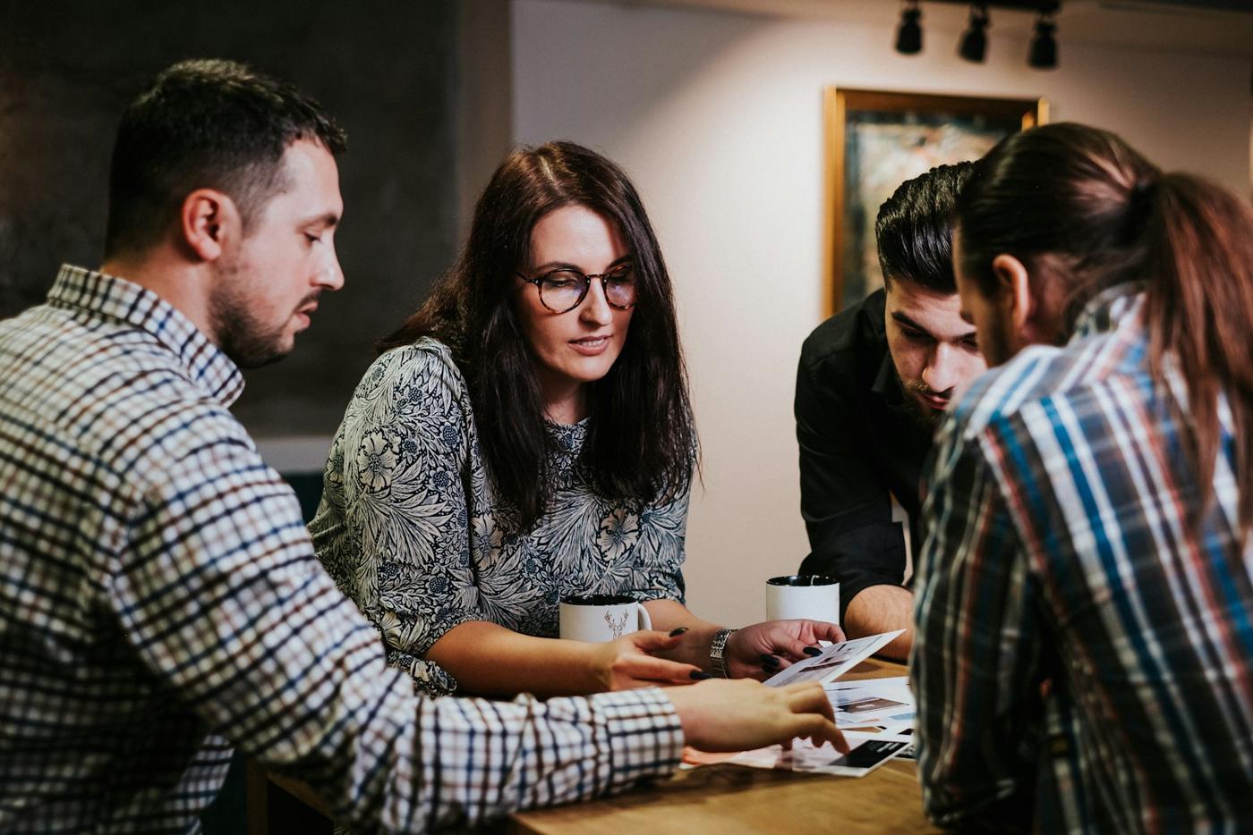 Creative team reviewing project documents